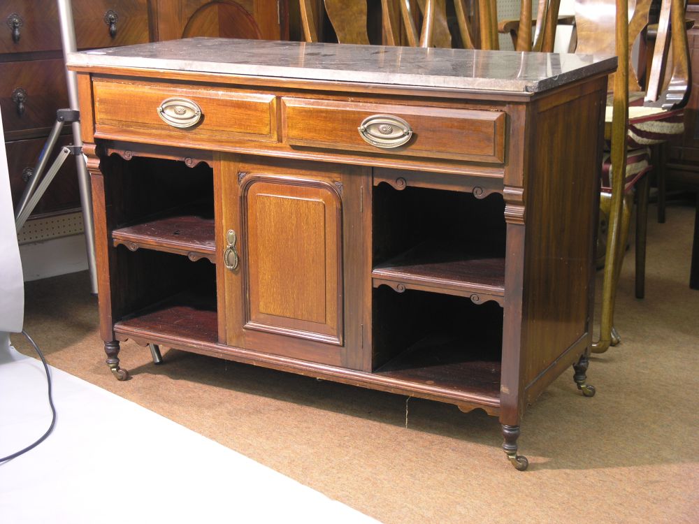 Appraisal: An early th century mahogany side table with marble top