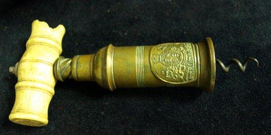 Appraisal: Heeley Sons patent brass corkscrew with an ivory handle