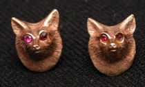 Appraisal: Fox Ear Studs with Ruby Eyes K yellow gold ear