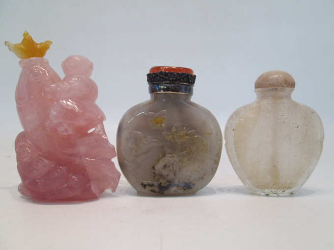 Appraisal: THREE CHINESE HARDSTONE AND GLASS SNUFF BOTTLES the first of