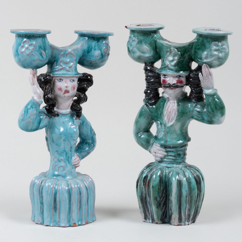 Appraisal: Near Pair of Wiener Werkst tte Glazed Earthenware Figural Two-Light