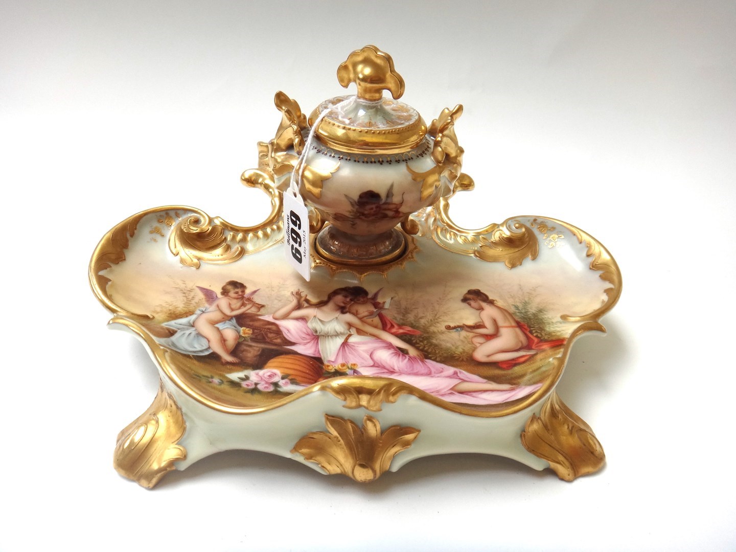 Appraisal: A Vienna style porcelain inkwell th century decorated with a