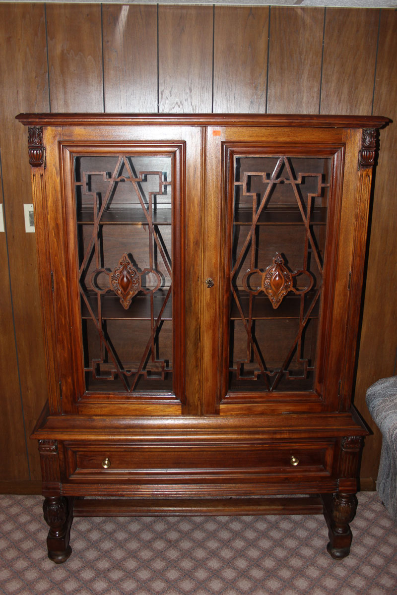 Appraisal: a Jacobean Revival style china cabinet mahogany and glass panel