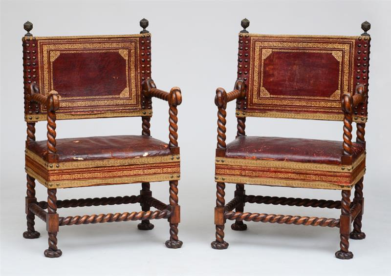 Appraisal: PAIR OF FLEMISH BAROQUE STYLE STAINED WALNUT AND LEATHER ARMCHAIRS