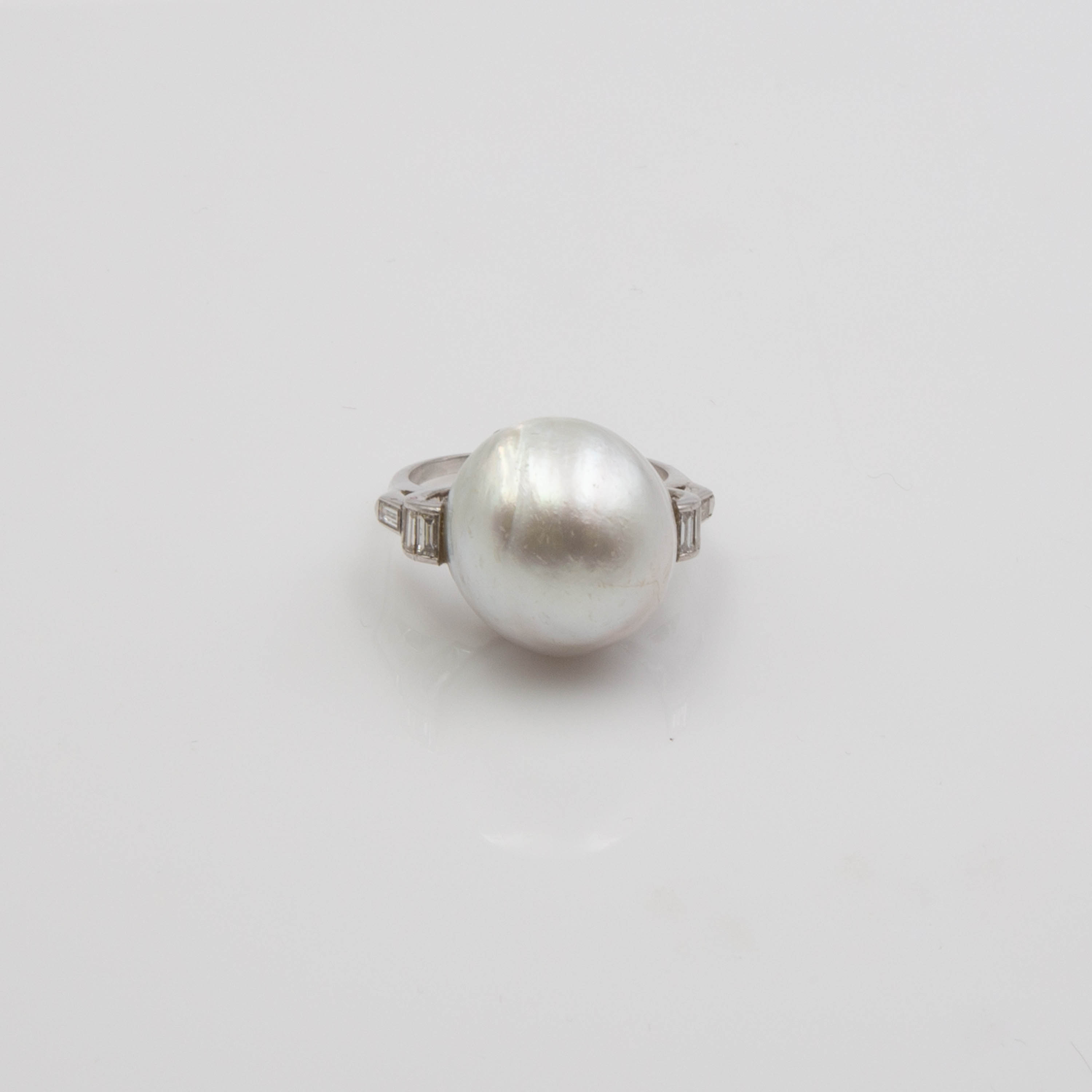 Appraisal: PLATINUM AND PEARL RING A platinum ring tested with eight