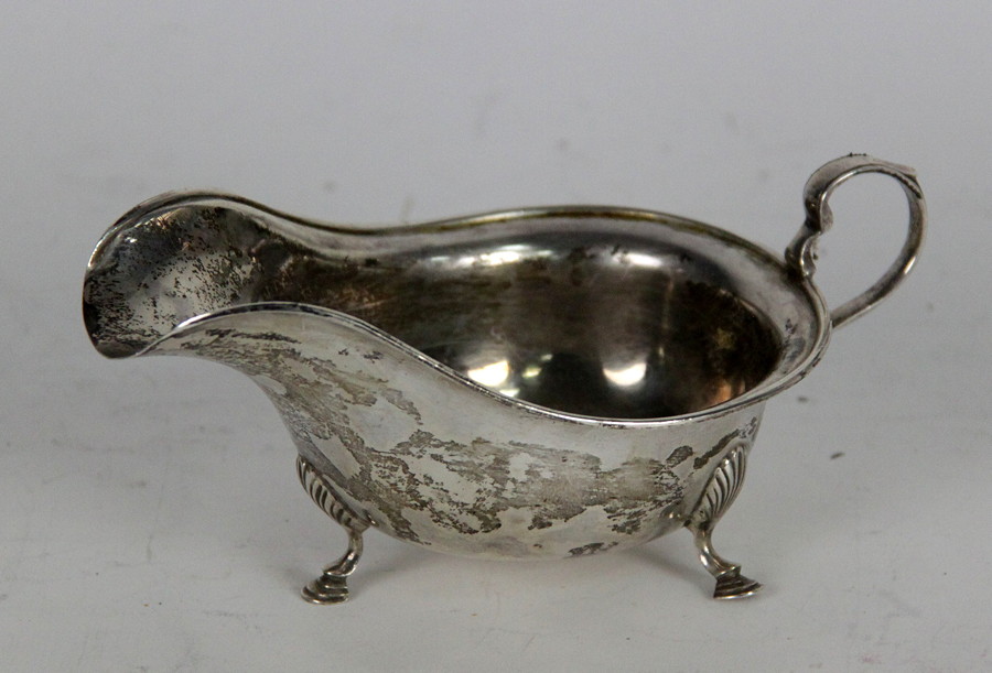 Appraisal: A silver sauce boat Charles William Fletcher Sheffield with scroll