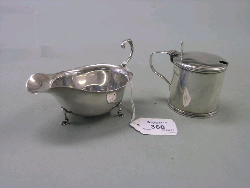 Appraisal: A Victorian silver mustard pot circular straight-sided form with hinged