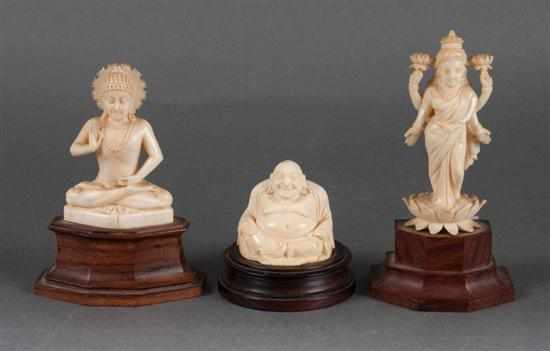 Appraisal: Indian carved ivory Buddha deity and Hotai figures all mounted