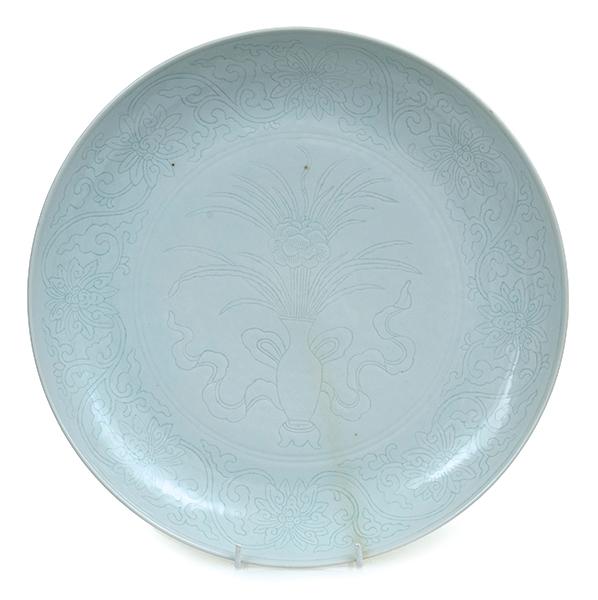 Appraisal: A CHINESE PALE CELADON CARVED CHARGER GUANGXU MARK TO BASE