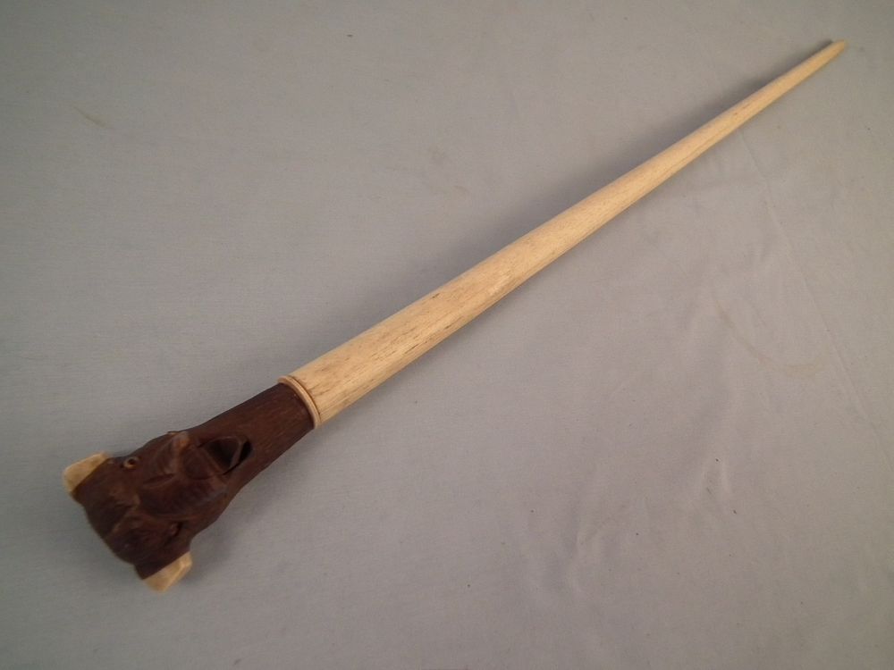 Appraisal: ANTIQUE BONE CANE W ANIMAL Antique captain's cane with whale