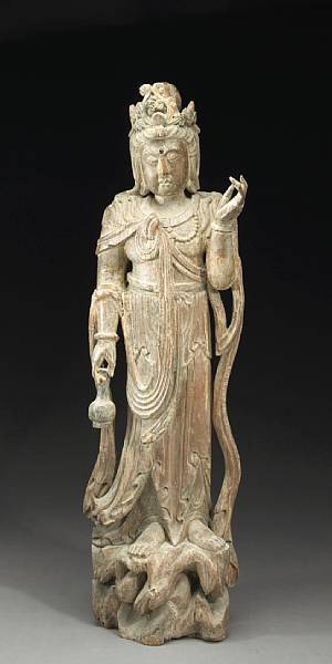 Appraisal: A carved wood figure of Guanyin Modeled after Ming prototypes