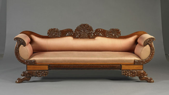 Appraisal: CLASSICAL CARVED MAHOGANY INLAID SOFA The scrolling crest carved with