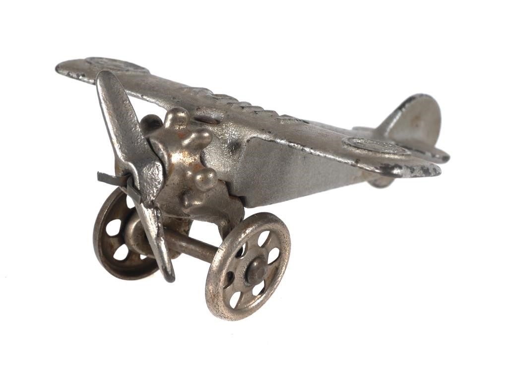 Appraisal: 's small Lindy cast iron toy airplane under left wing