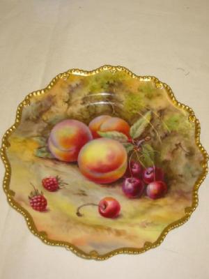 Appraisal: A ROYAL WORCESTER PORCELAIN PLATE painted with peaches and cherries