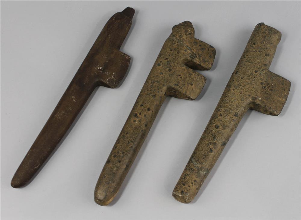 Appraisal: THREE STONE EFFIGY AXES one steatite axe with a human