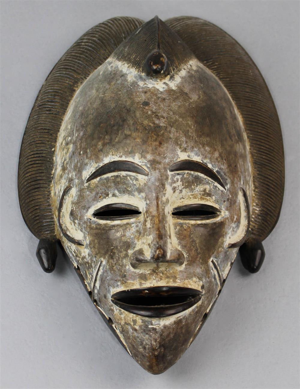 Appraisal: PUNU GABON AFRICA CARVED FEMALE MASK idealized face with remnants