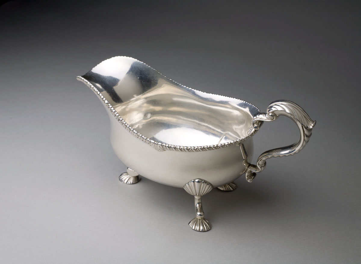 Appraisal: GEORGE III SILVER CRESTED SAUCEBOAT WILLIAM SOUTHEY LONDON - The