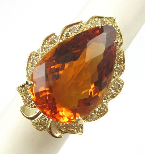 Appraisal: CITRINE DIAMOND AND FOURTEEN KARAT GOLD RING with round-cut diamonds