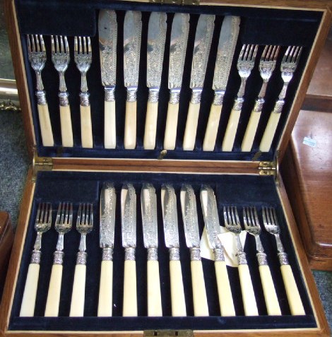 Appraisal: Twelve pairs of silver fish knives and forks with engraved