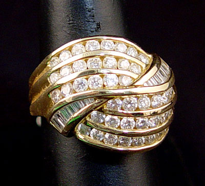 Appraisal: K BAGUETTE DIAMOND COCKTAIL RING Contains round brilliant and straight