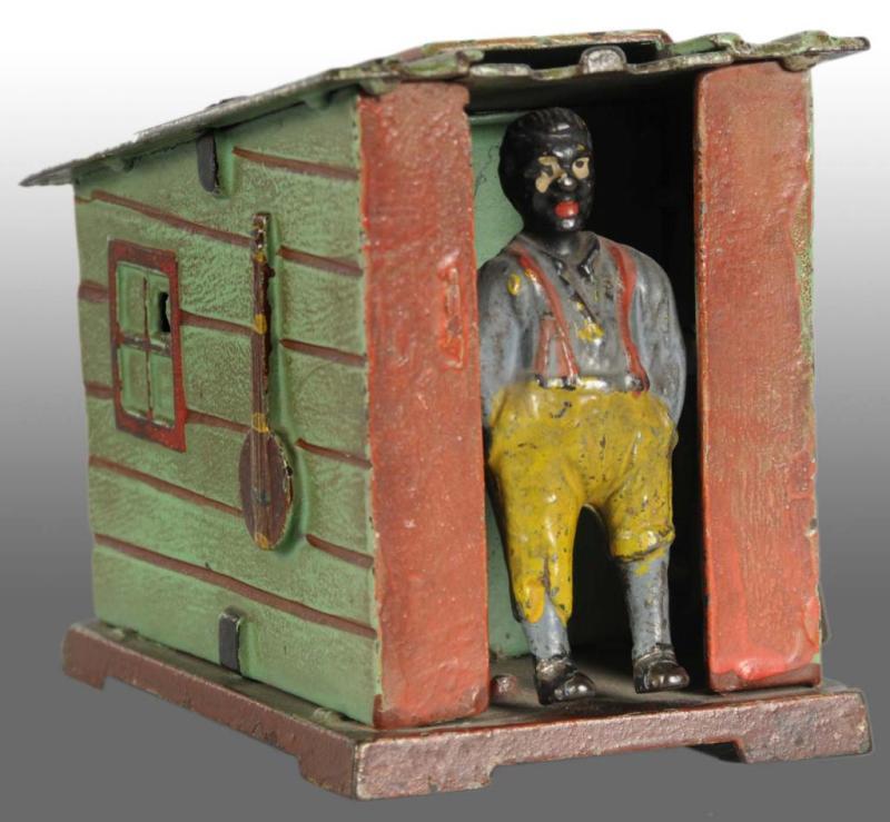 Appraisal: Cast Iron Cabin Mechanical Bank Description Manufactured by J E