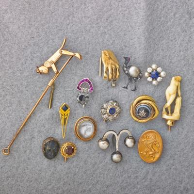 Appraisal: FOURTEEN GOLD OR SILVER STICK PINS Gold mechanical climbing monkey