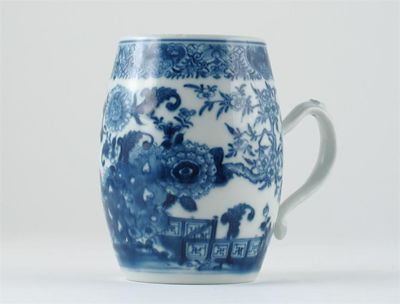 Appraisal: A Chinese blue and white barrel-shaped mug painted with peony