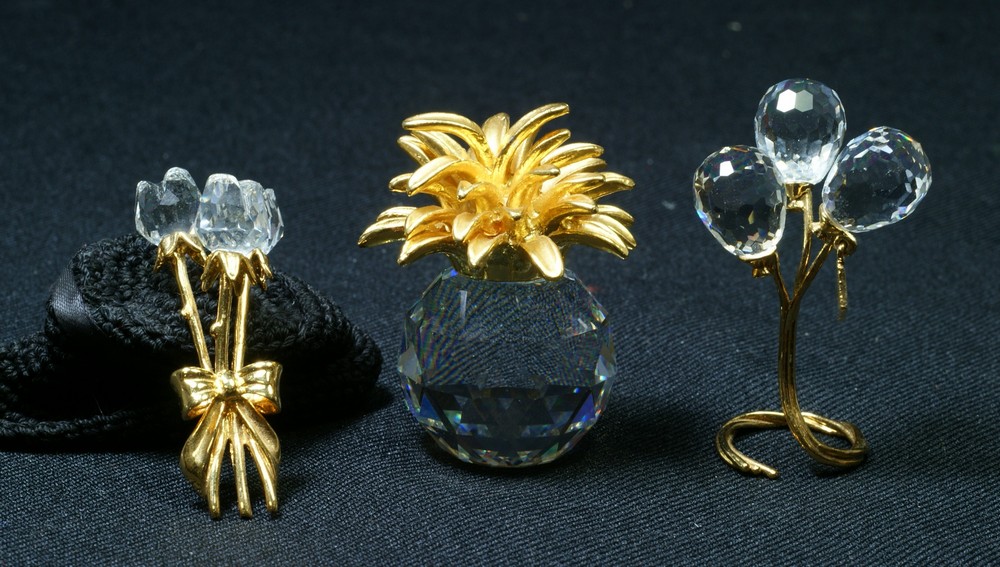 Appraisal: Swarovski crystal gold colored figurines pineapple balloons bouquet of roses