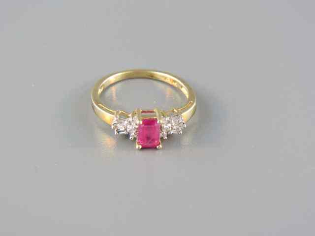 Appraisal: Ruby Diamond Ring carat emerald cut gem with a trio