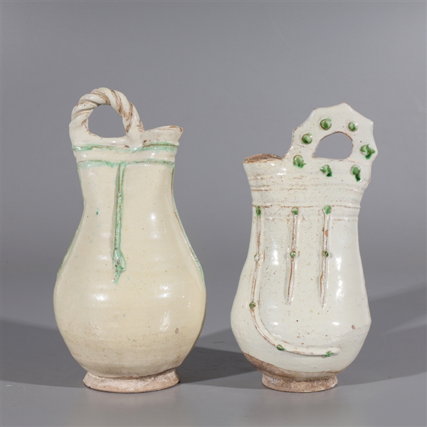 Appraisal: Two Chinese glazed ceramic ewers each with molded handles and