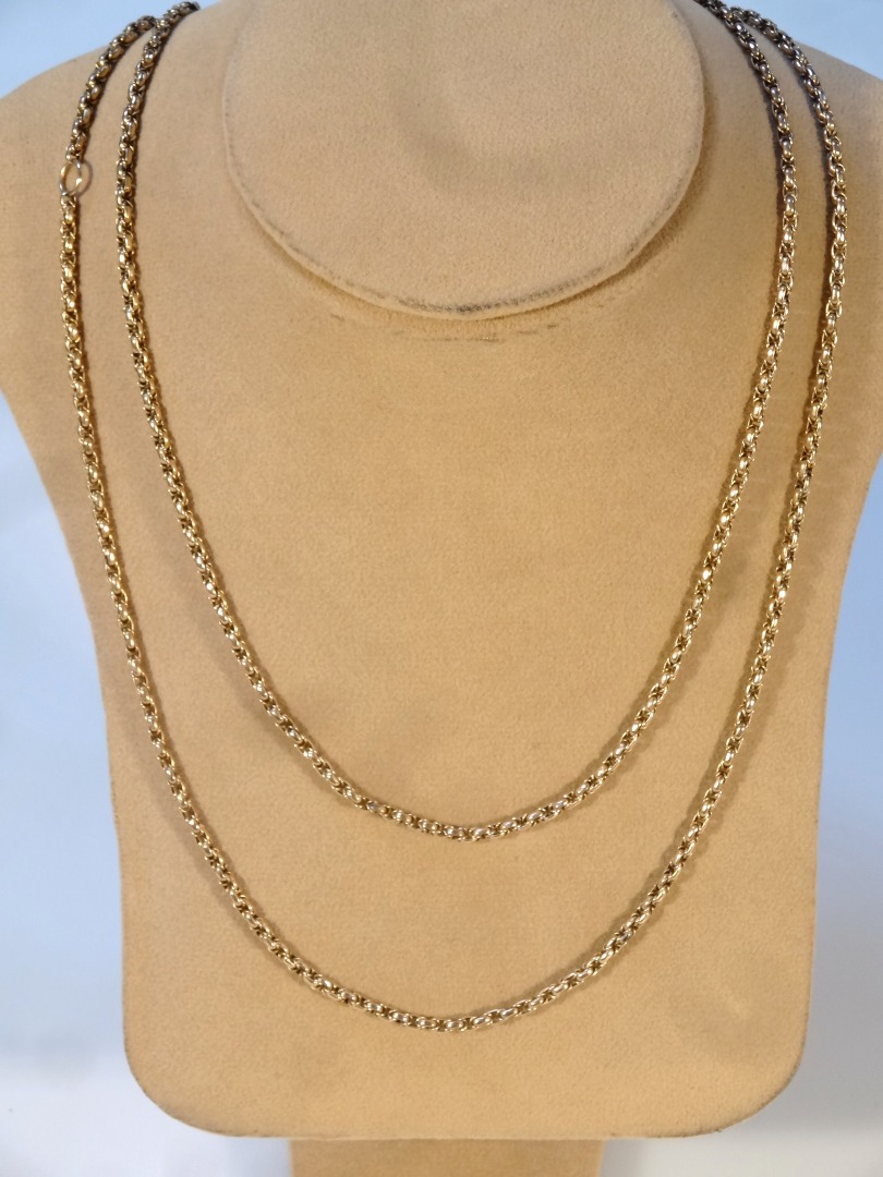 Appraisal: A guard chain with slender links and clasp end marked