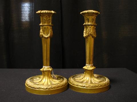 Appraisal: PAIR OF FRENCH GILT-BRONZE CANDLESTICKS in the Louis XVI style