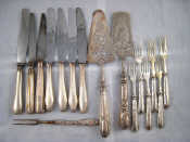 Appraisal: A set of six dessert forks with silver handles together