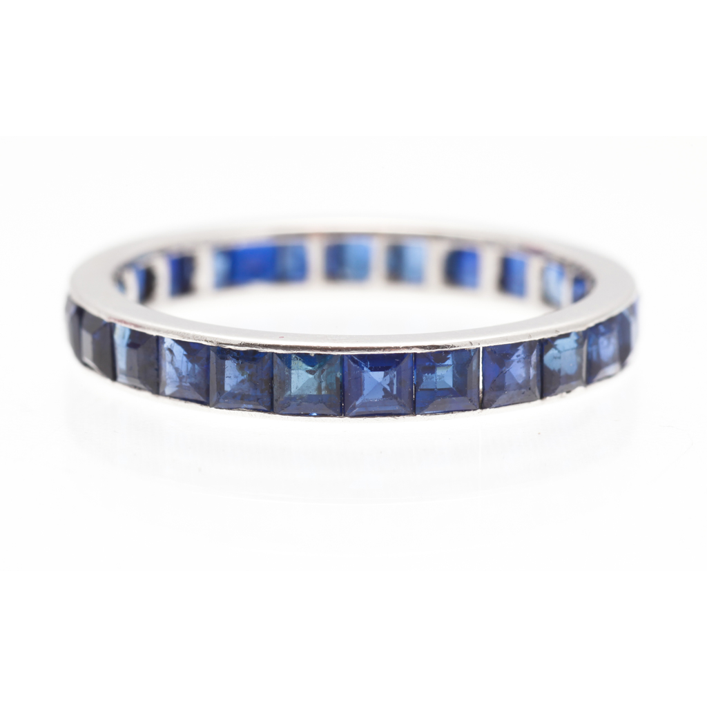 Appraisal: A sapphire set eternity ring channel set with a single