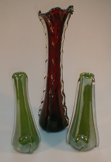 Appraisal: A pair of lustre glass vases and another