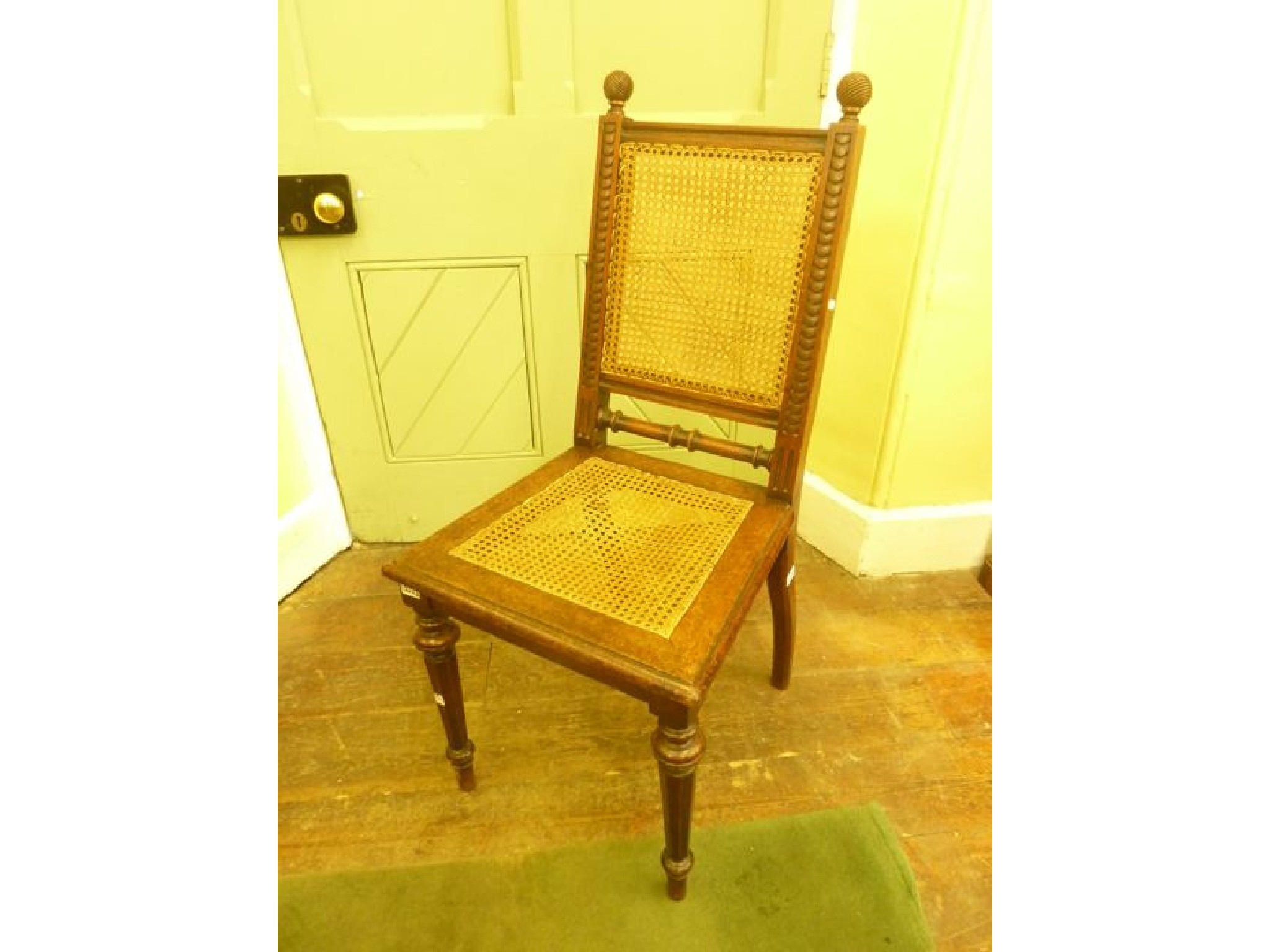 Appraisal: A th century walnut single chair with cane panelled seat