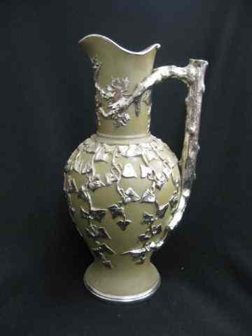 Appraisal: Mettlach Pottery Pitcher silver luster leaf vine decor on brown