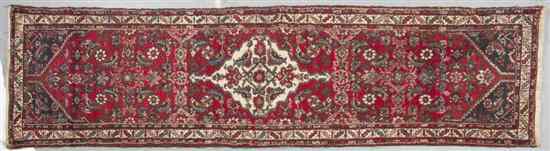 Appraisal: A Northwest Persian Wool Runner having a foliate center medallion