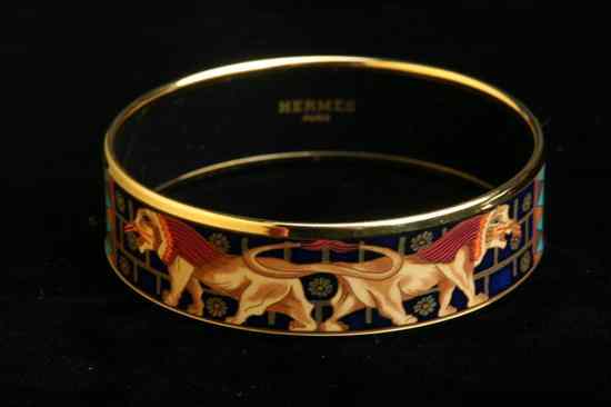 Appraisal: HERM S ENAMELLED AND GOLD-PLATED BANGLE BRACELET Signed Made in