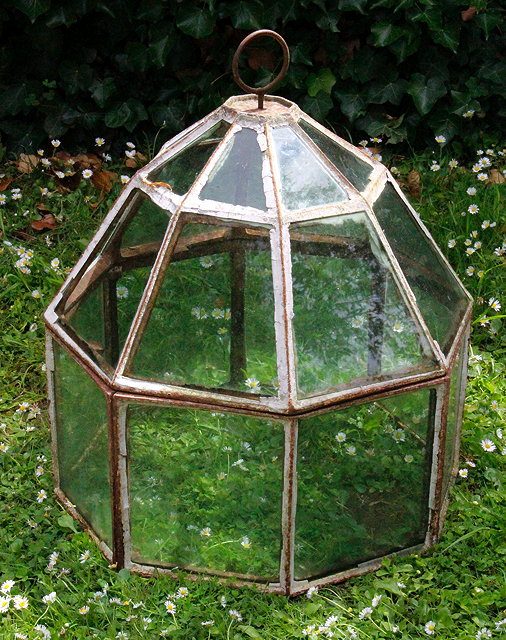 Appraisal: A CAST IRON GLAZED OCTAGONAL CLOCHE with domed cover cm