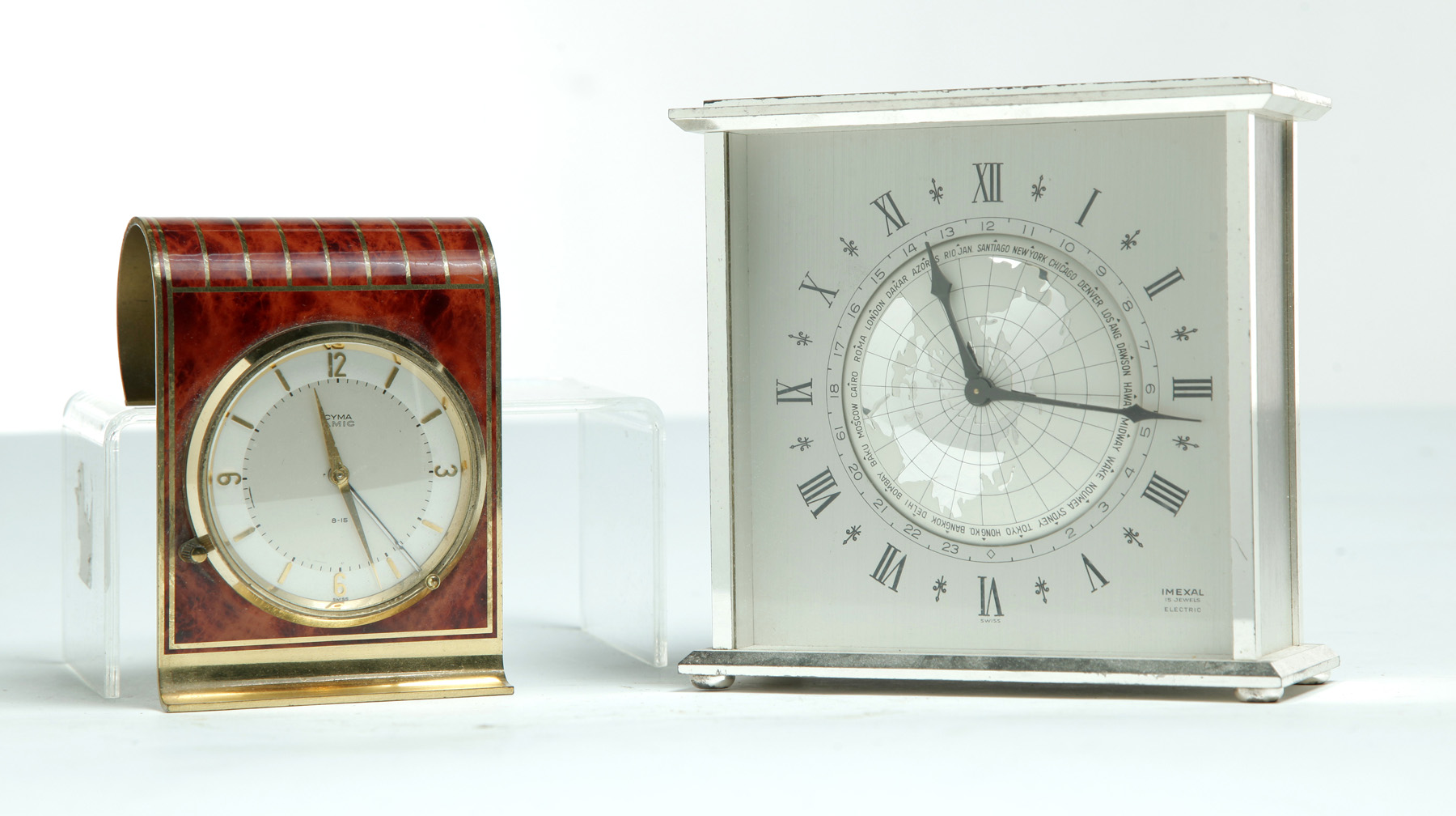 Appraisal: TWO SWISS CLOCKS Mid th century Imexal world time clock