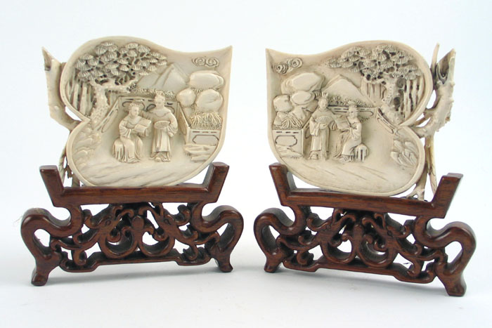 Appraisal: PAIR JAPANESE IVORY HAND CARVED LANDSCAPES each with figures in