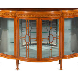 Appraisal: An Edwardian Satinwood and Marquetry Serpentine-Front Cabinet Circa Height x