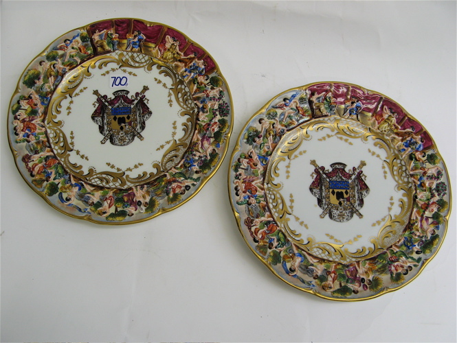 Appraisal: PAIR CAPODIMONTE PORCELAIN PLATES hand painted with coat of arms