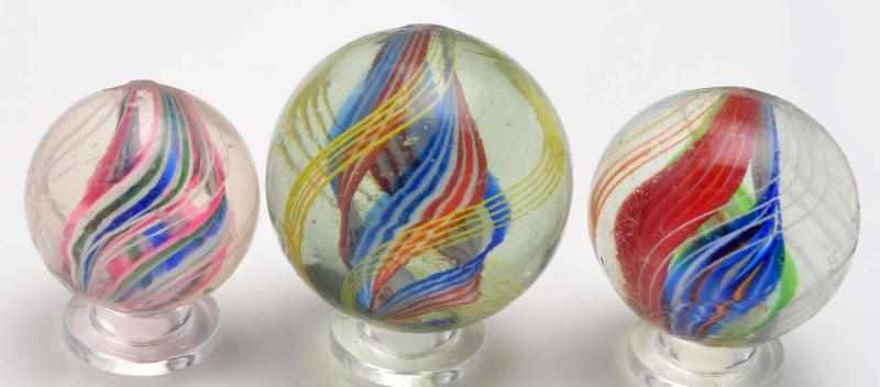 Appraisal: Lot of Divided Core Swirl Marbles Description The smaller marble