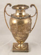 Appraisal: A silver two handled vase with gadrooned rim on square