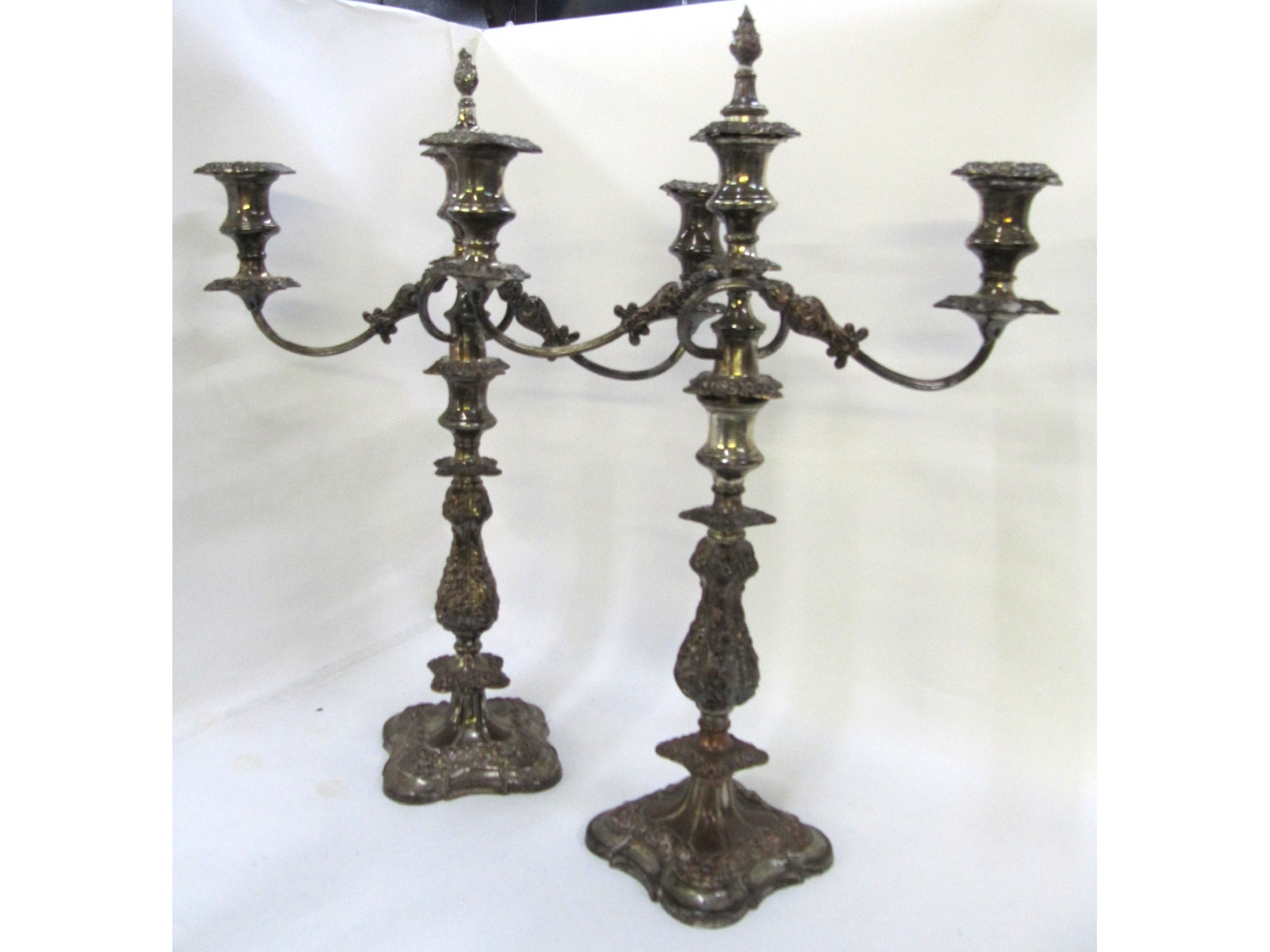 Appraisal: A pair of silver plated two-branch candelabra