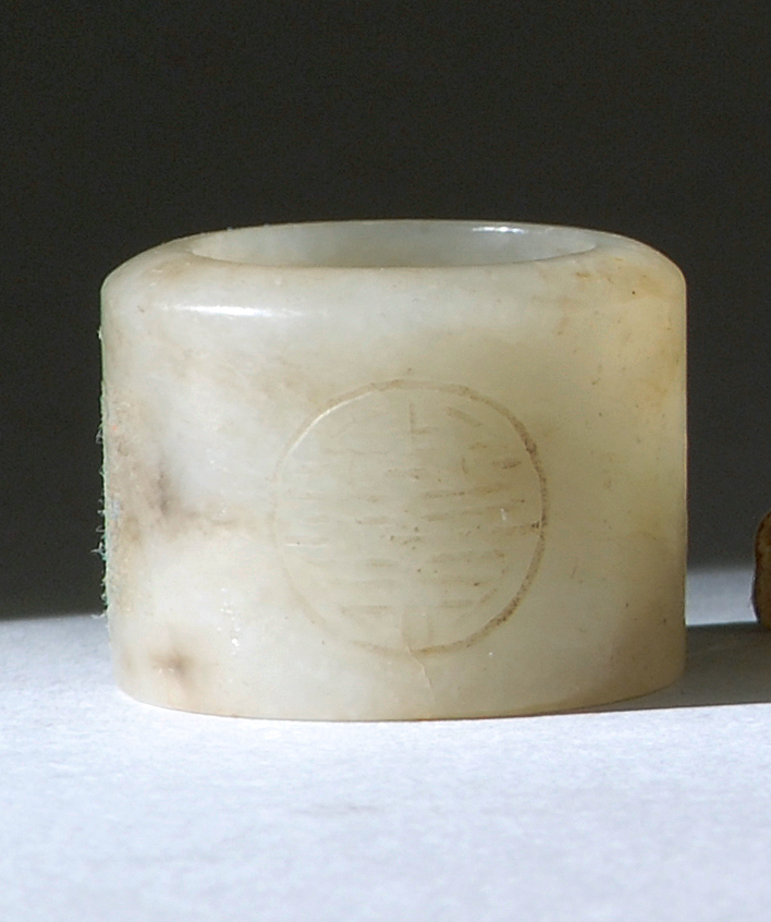 Appraisal: GRAY-WHITE JADE SCHOLAR'S RING th CenturyIn cylinder form with two