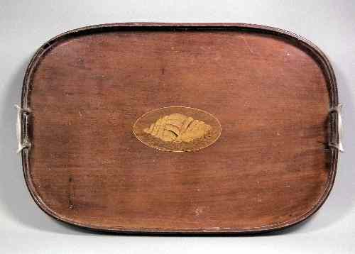 Appraisal: An Edwardian mahogany oval two-handled tray with marquetry shell motif