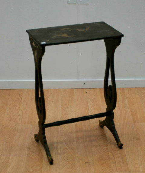 Appraisal: A black lacquered occasional table decorated with an Imperial design